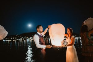 couple holding a flying lantern