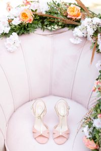 pink heels on a pink chair
