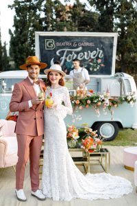 spring wedding couple in front of a mobile bar van